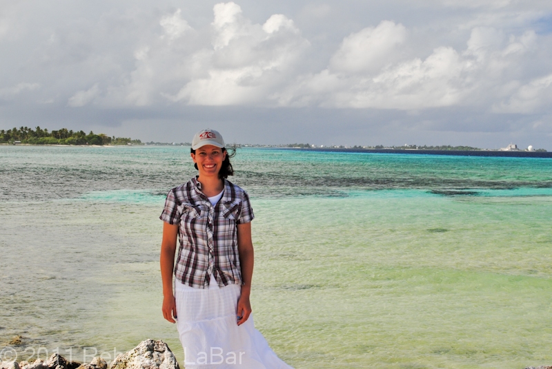 Me, standing at Beach Park on the south tip of Ebeye. Looking south across the reef towards Big and Little Bustard (left) and Kwajalein